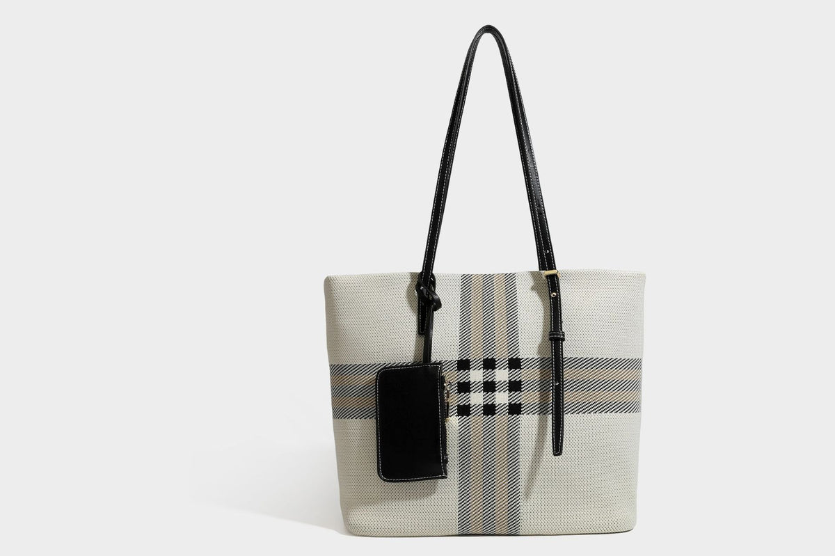 Large structured plaid check tote bag with smooth tan leather-look shoulder straps, attached front zip pouch, and gold-tone