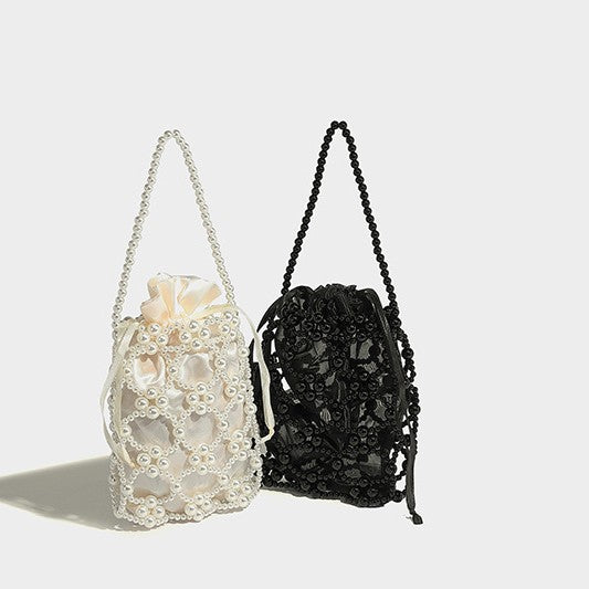 Small pearl-beaded lattice drawstring bucket bag with beaded shoulder strap and ribbon closure, detail view 2
