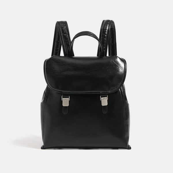 Structured glossy leather-look flap backpack with twin buckle closures and top grab handle, detail view 7