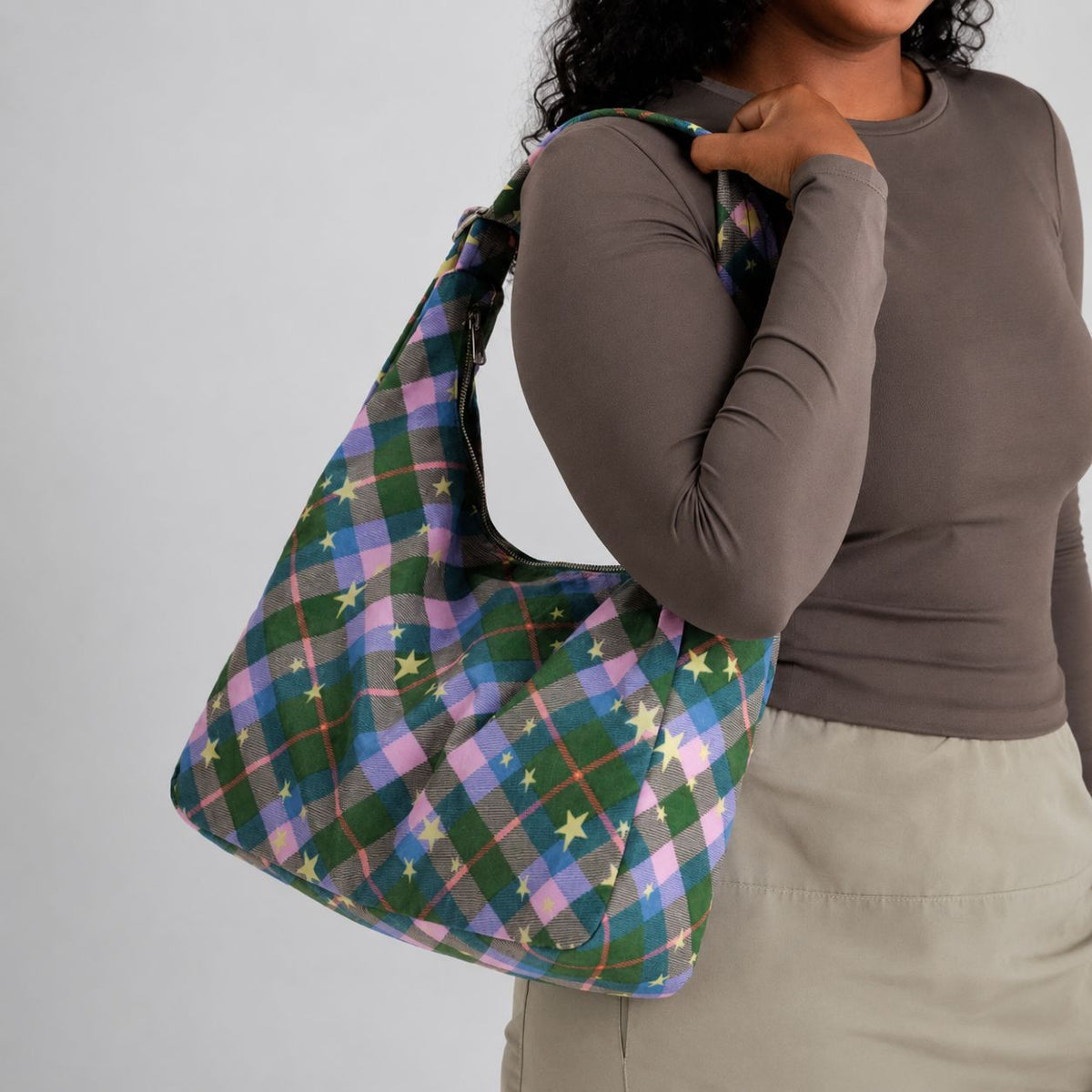 Multicolor plaid and star print hobo shoulder bag with knotted strap and silver-tone zip closure, detail view 12