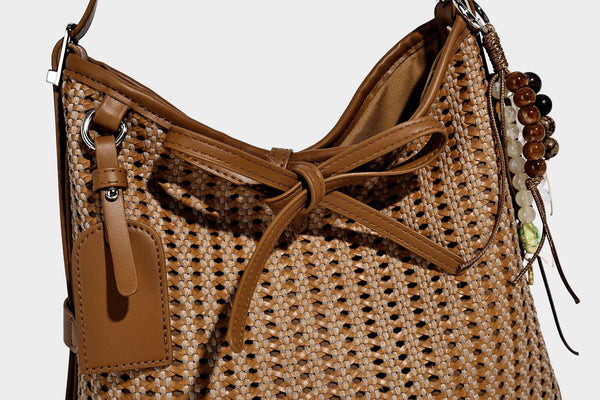 Slouchy open-weave shoulder tote bag with leather-look tan trim, tie-front closure, and long adjustable strap, detail view 16