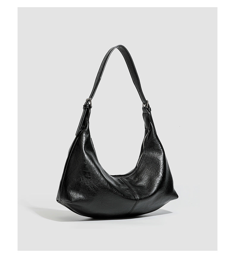 Slouchy crescent hobo shoulder bag with zip-top closure and adjustable strap, detail view 17