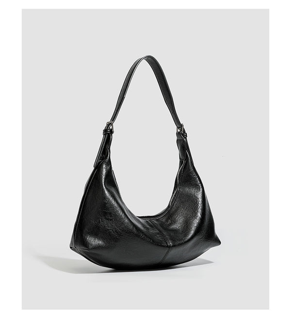 Slouchy crescent hobo shoulder bag with zip-top closure and adjustable strap, detail view 17