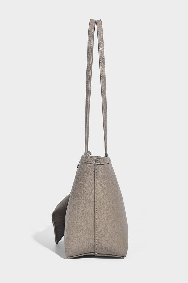 Structured pebbled leather-look tote bag in taupe with long shoulder strap, detachable zip pouch, and pink tulip flower
