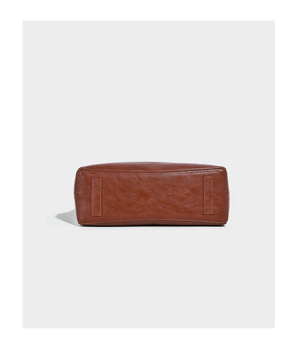 Glossy leather-look slouchy hobo shoulder bag with zip closure, gold-tone hardware, and adjustable strap, detail view 10