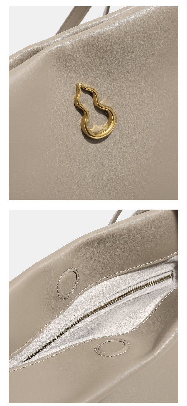 Smooth leather-look slouchy trapezoid shoulder tote with gold-tone gourd clasp hardware and long slim straps, detail view 10