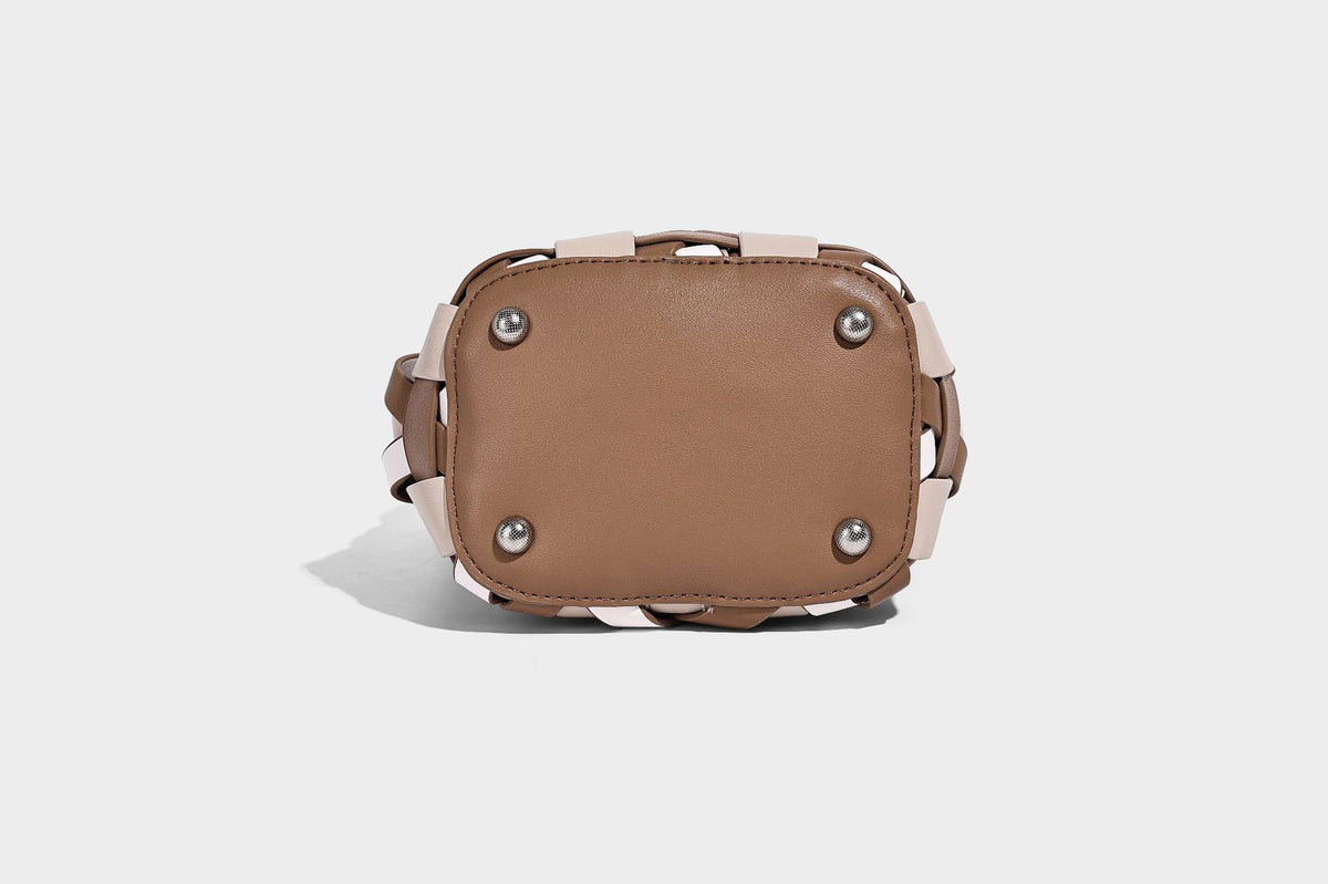 Small woven lattice bucket bag in tan and cream leather-look strips with drawstring top and detachable crossbody strap
