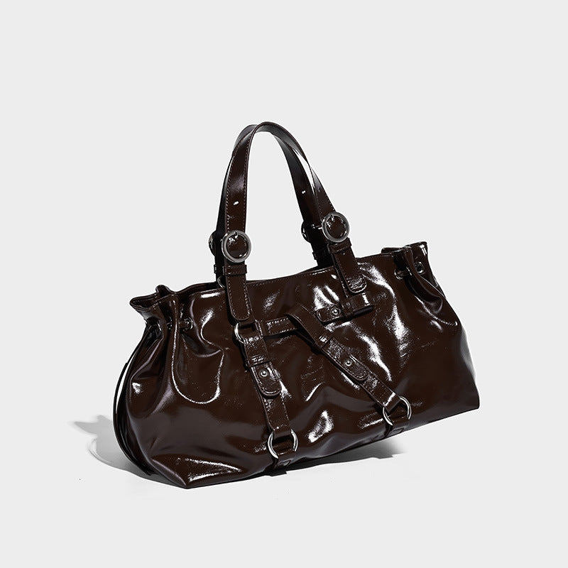 Glossy patent-look slouchy tote bag with ruched drawstring sides, dual top handles, silver ring hardware, and detachable