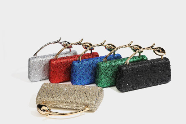 rectangular hard-case rhinestone evening clutch with sculptural gold-tone branch-and-bud top handle and detachable chain