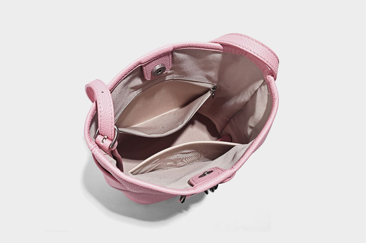 Small pebbled leather-look bucket bag with front drawstring toggle hardware and long adjustable shoulder strap, detail view