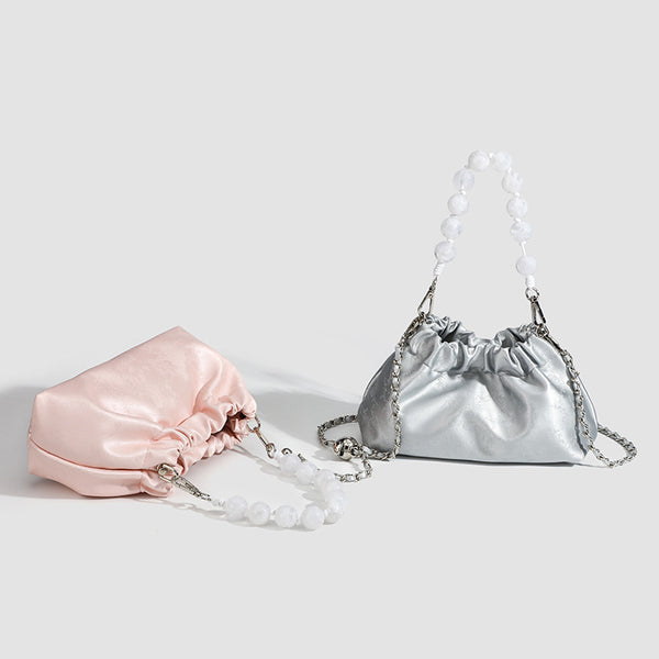 Small ruched drawstring pouch bag with pearl-bead handle and silver-tone chain strap, detail view 2