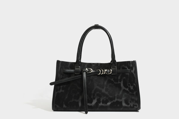 Structured leopard-print tote bag with glossy satin-like finish, dual rounded top handles, silver buckle-and-ring front