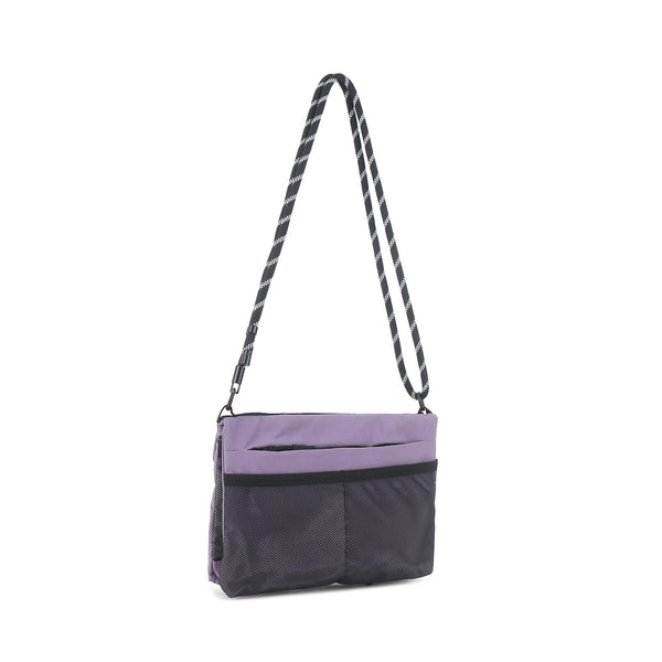 Flat rectangular crossbody bag with mesh front pocket, top zip closure, and adjustable patterned strap, detail view 17