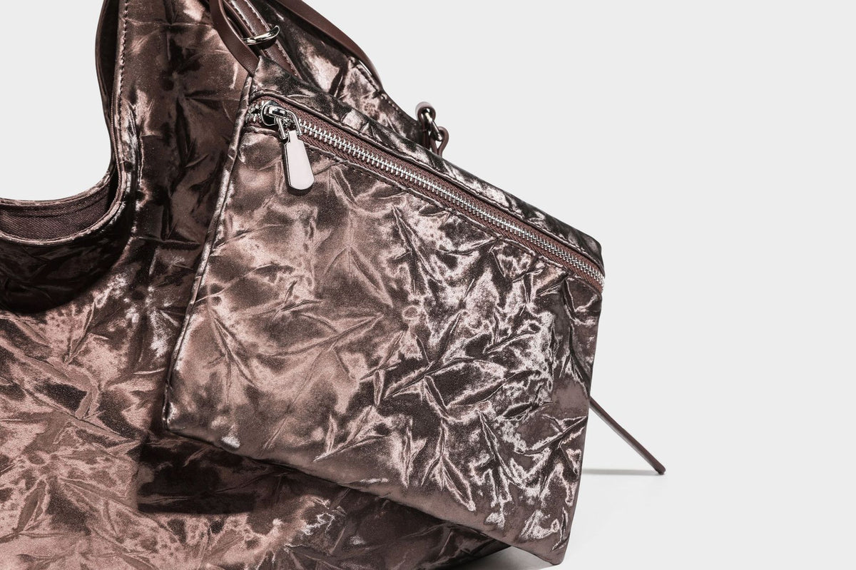 Slouchy crinkle-finish shoulder tote bag with silver hardware and attached zip pouch, detail view 25