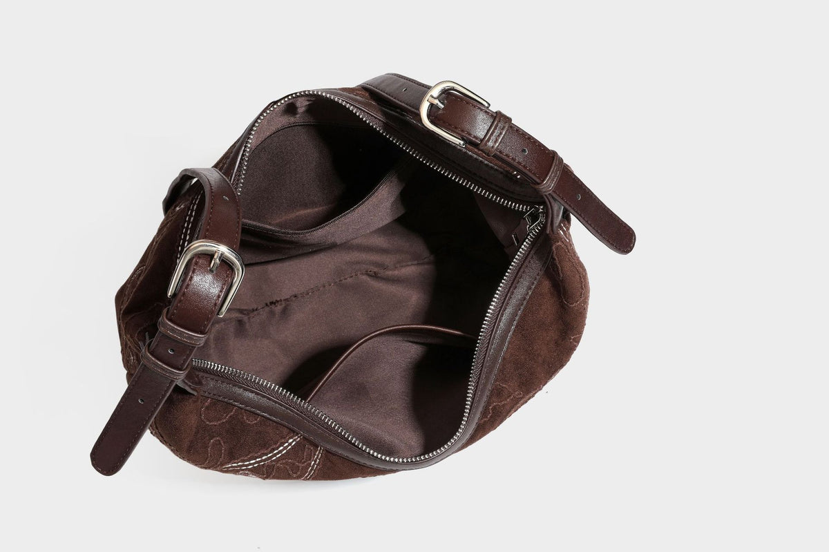 Deep chocolate suede-look hobo shoulder bag with tonal paisley floral embroidery, smooth dark leather-look trim, top zip