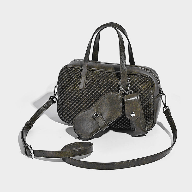Structured woven-texture front top-handle handbag with zip closure, dual handles, detachable shoulder strap, and matching