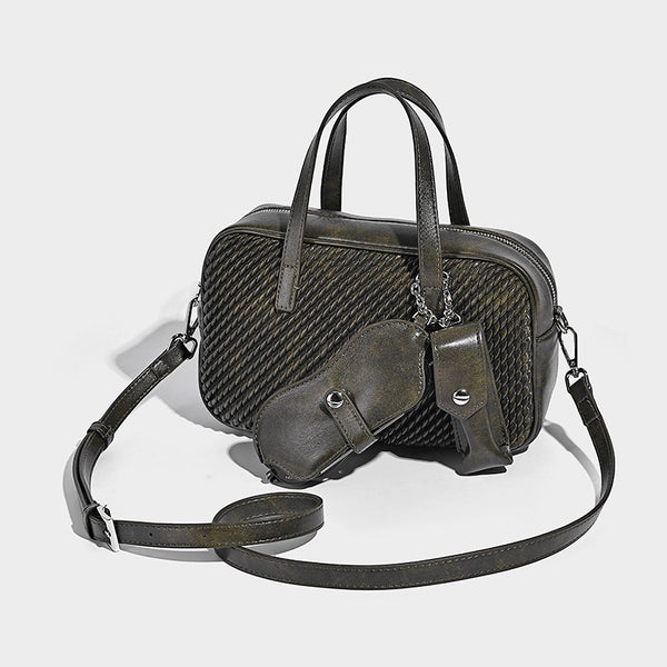 Structured woven-texture front top-handle handbag with zip closure, dual handles, detachable shoulder strap, and matching