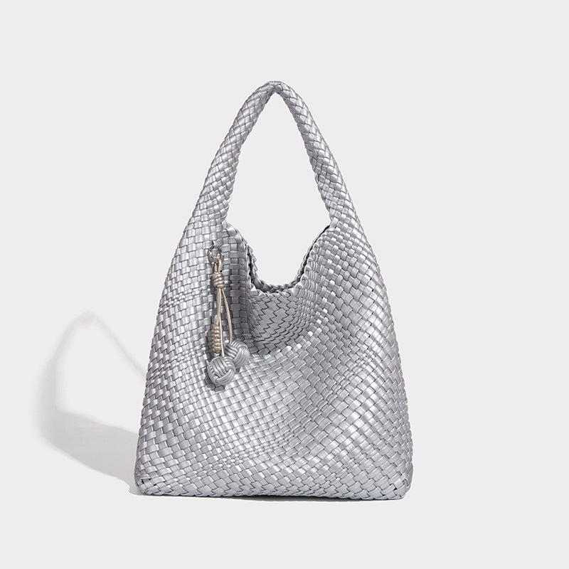 Soft hand-woven slouchy hobo tote bag with knotted tassel charm and single looped shoulder strap, detail view 10
