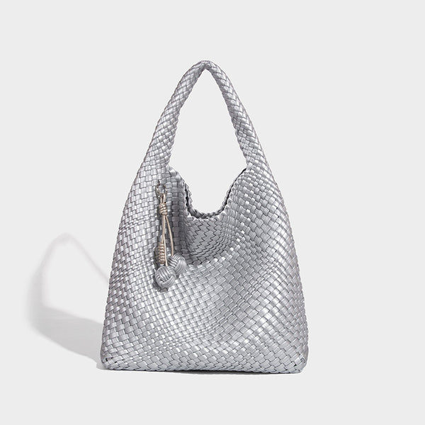Soft hand-woven slouchy hobo tote bag with knotted tassel charm and single looped shoulder strap, detail view 10