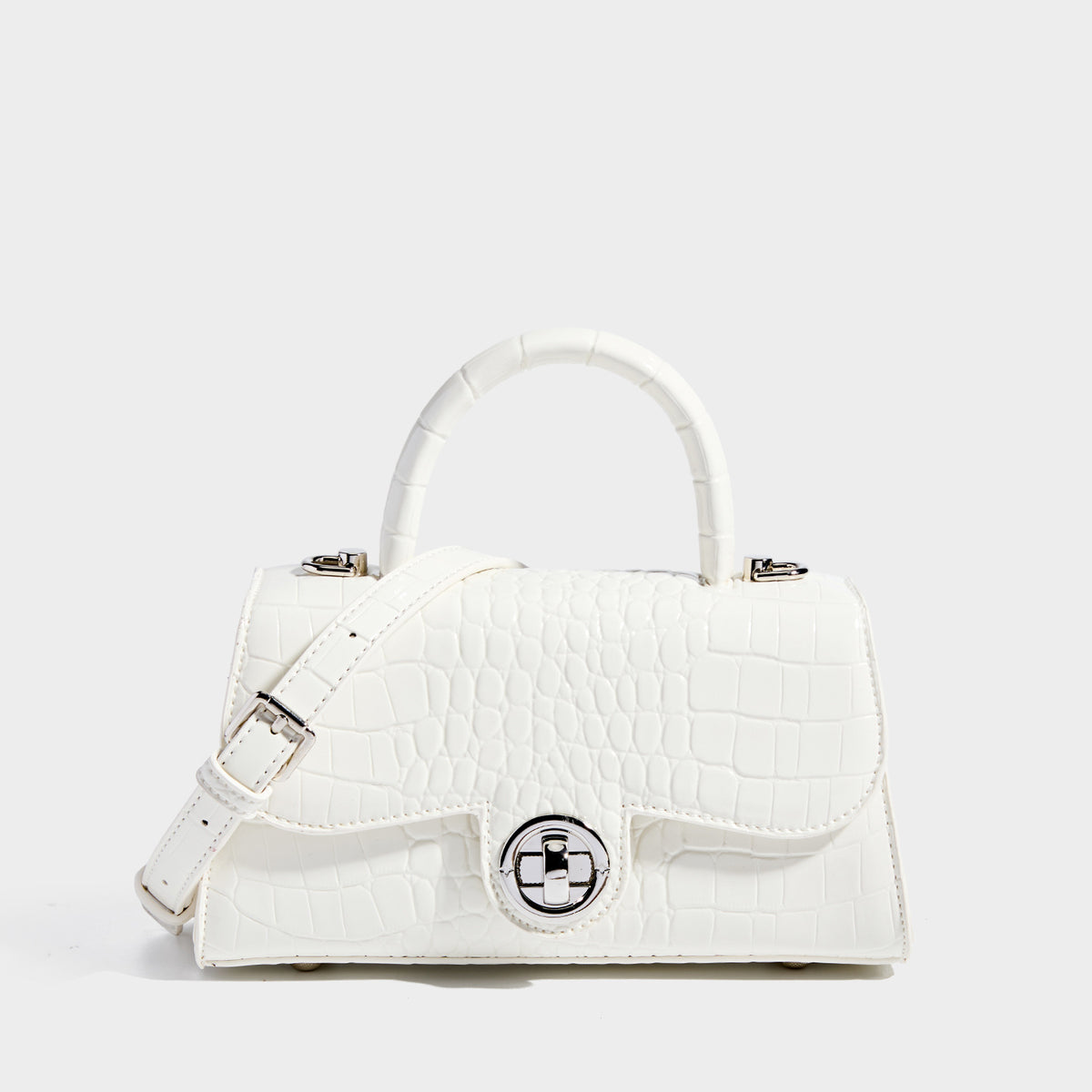 Mini croc-embossed glossy structured handbag with silver-tone turn-lock clasp and short top handle, detail view 7