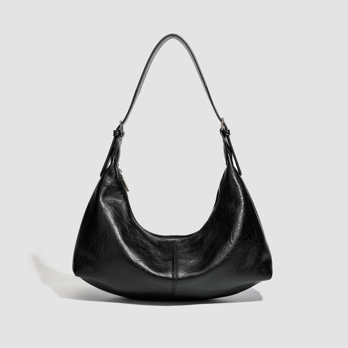Slouchy crescent hobo shoulder bag with zip-top closure and adjustable strap, detail view 6