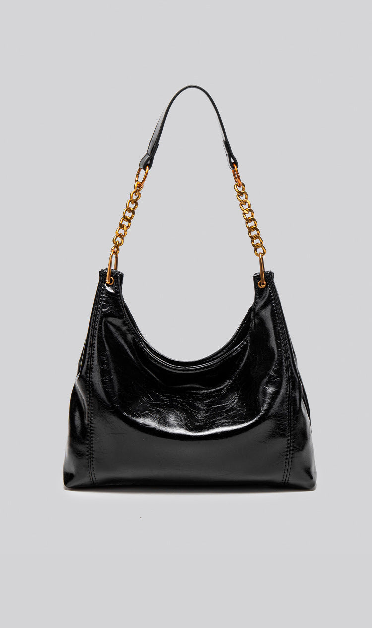 Glossy leather-look hobo shoulder bag with gold-tone chain-and-leather strap in deep burgundy red, detail view 15