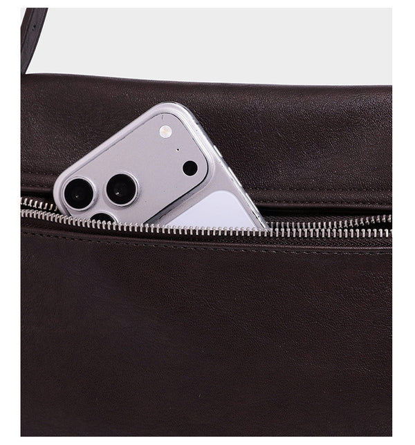 Structured rectangular flap shoulder bag in dark brown leather-look finish with long single strap and layered front panel