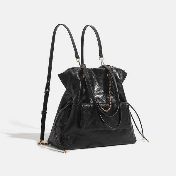 Quilted crinkled leather-look convertible tote backpack with gold-tone chain handles and drawstring closure, detail view 3