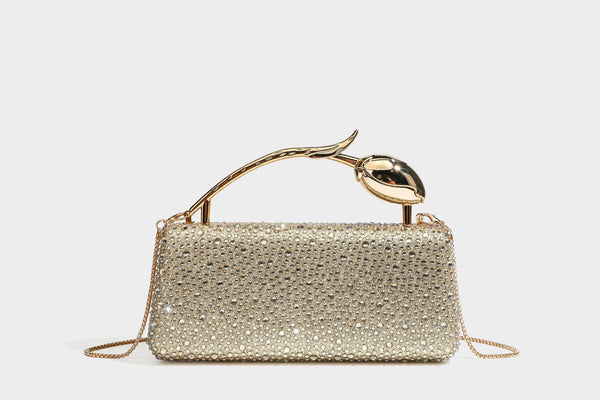 rectangular hard-case rhinestone evening clutch with sculptural gold-tone branch-and-bud top handle and detachable chain
