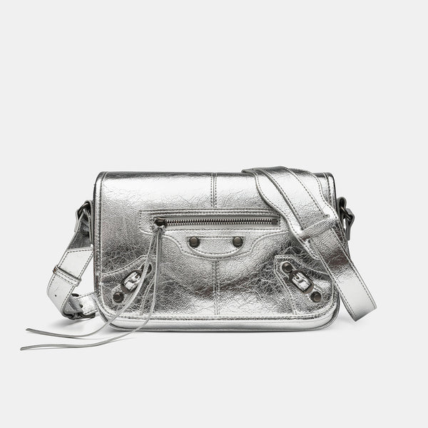 Small structured rectangular crossbody bag with crinkle leather-look finish, front zip pocket, gunmetal stud hardware, and