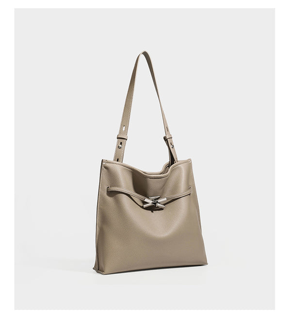 Pebbled leather-look tote bag with front toggle hardware and long shoulder strap, detail view 9