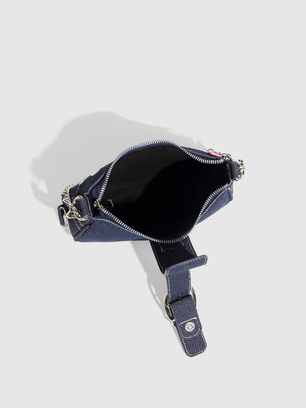 Dark navy denim-look shoulder bag with light blue and pink star appliqués, silver-tone buckle, chain strap, and short top
