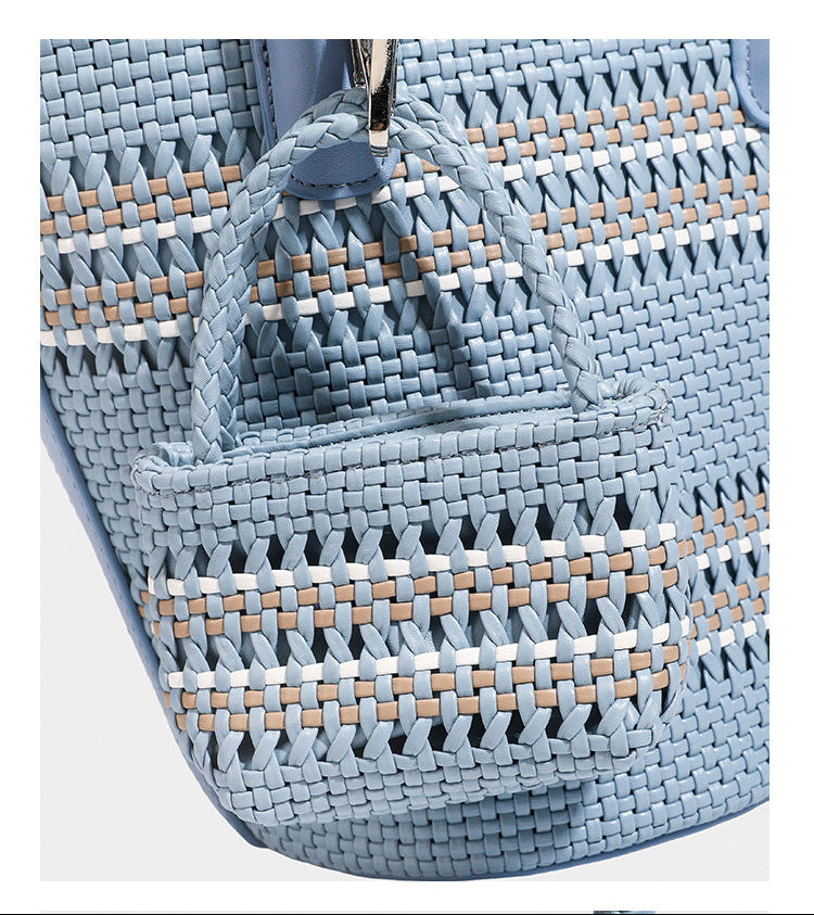 Light blue open-weave woven bucket tote bag with long braided shoulder straps, drawstring side ties, and attached mini pouch
