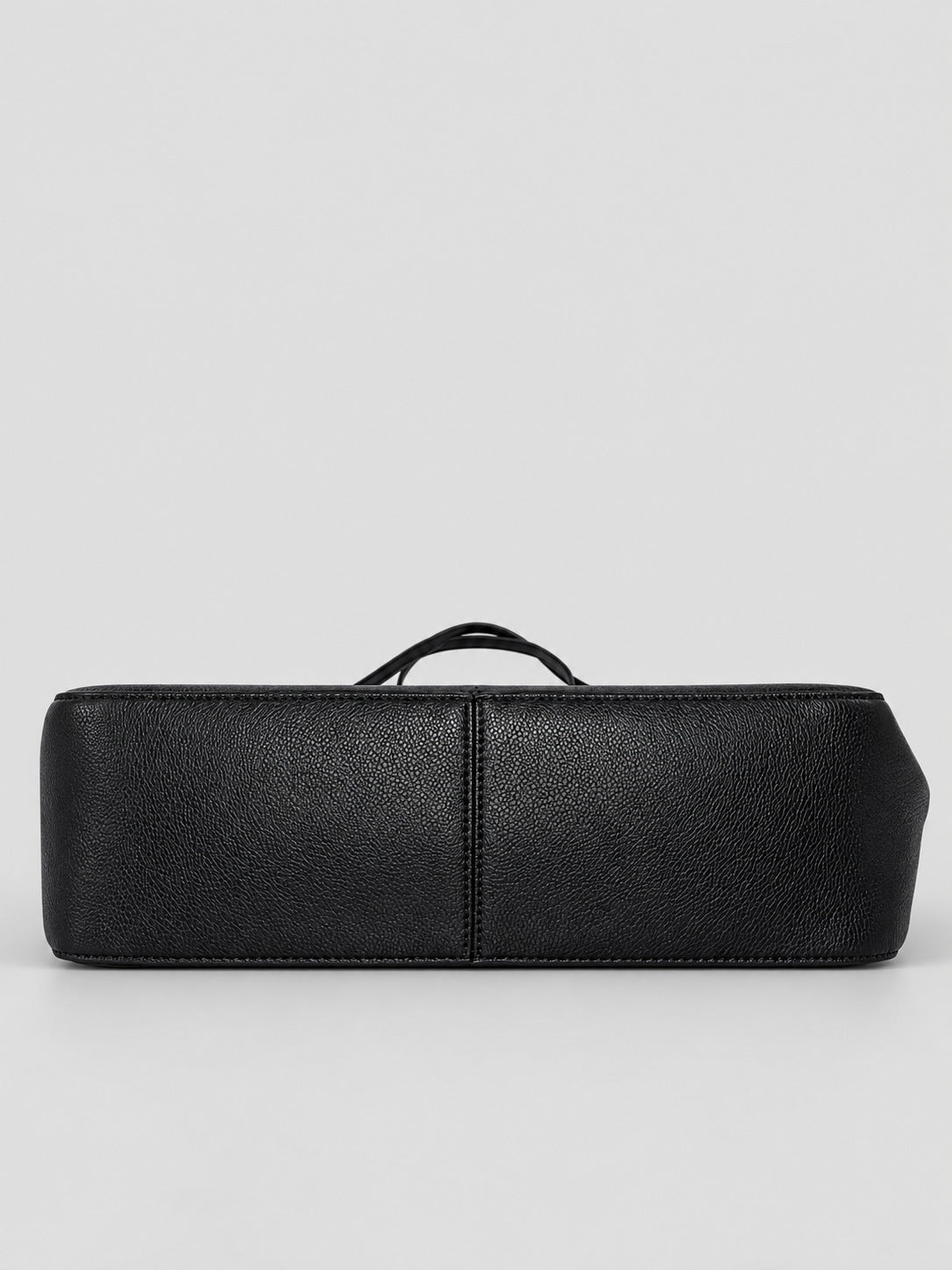 Structured black flap shoulder bag with pebbled texture, silver-tone turn-lock closure, and adjustable single shoulder strap