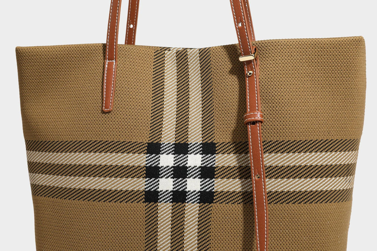 Large structured plaid check tote bag with smooth tan leather-look shoulder straps, attached front zip pouch, and gold-tone