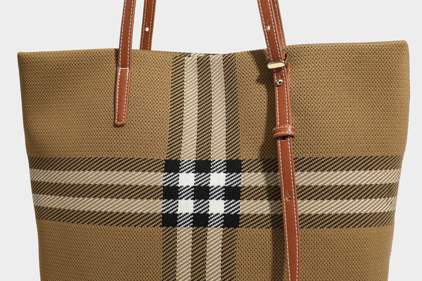 Large structured plaid check tote bag with smooth tan leather-look shoulder straps, attached front zip pouch, and gold-tone