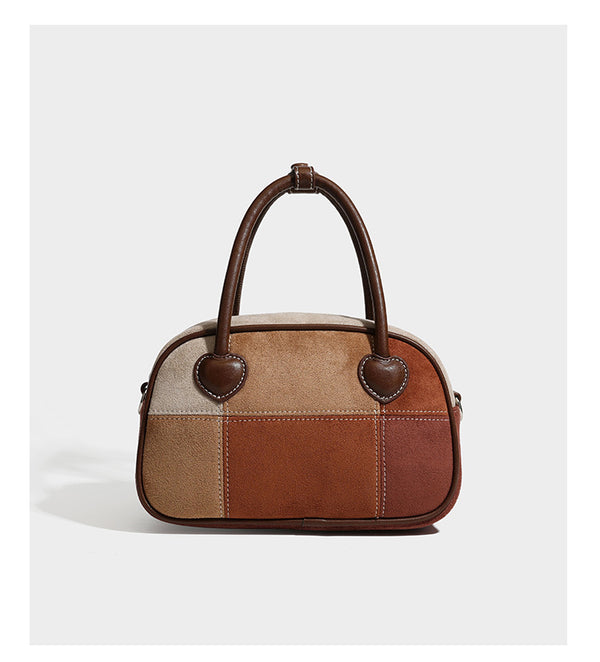 Kleine, strukturierte Henkeltasche aus Patchwork in Farbblöcken aus Beige, Camel, Braun und Rost mit dunkelbrauner Einfassung, herzförmigem