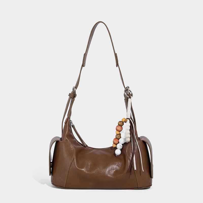 Soft pebbled leather-look hobo shoulder bag with zip top closure, side flap pockets, and silver-tone hardware, detail view 7