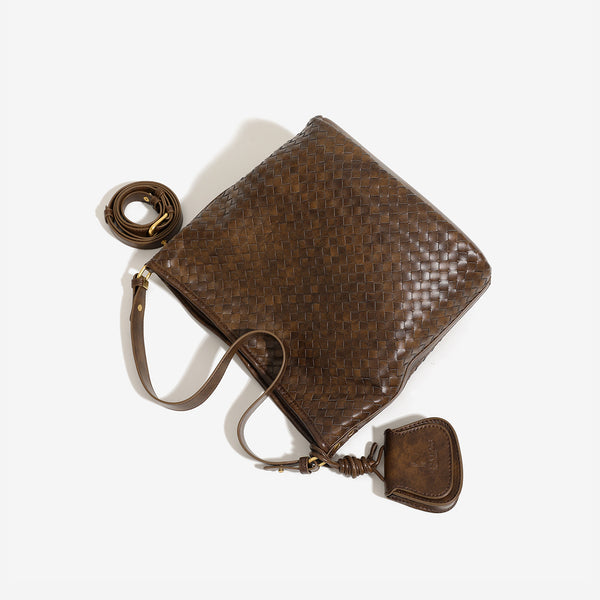 Dark brown woven leather-look bucket shoulder bag with mini pouch charm and gold-tone hardware, detail view 4