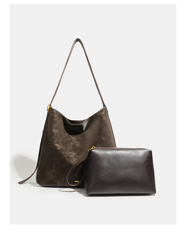 Large slouchy hobo tote bag in distressed dark brown leather-look finish with long shoulder strap, gold-tone ring hardware