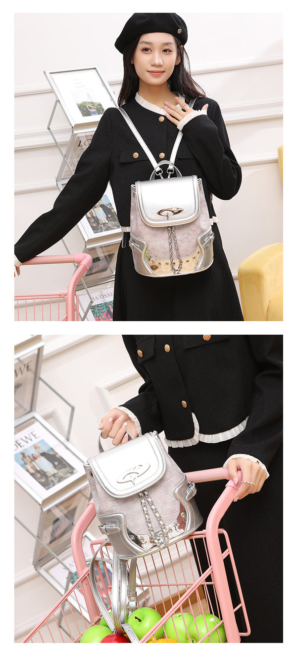 Croc-embossed mini backpack with silver metallic leather-look trim, decorative chain, and metal logo clasp, detail view 9