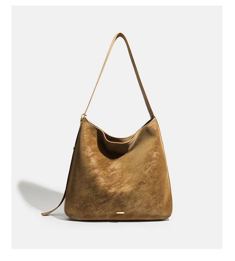 Large slouchy hobo tote bag in distressed dark brown leather-look finish with long shoulder strap, gold-tone ring hardware