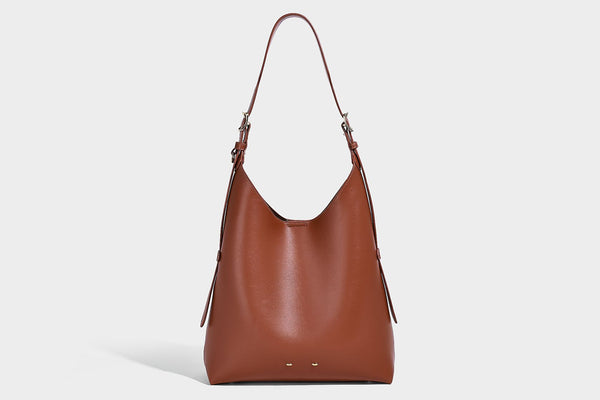 Large open-top hobo shoulder bag in tan leather-look finish with detachable zip pouch and adjustable buckle strap, detail