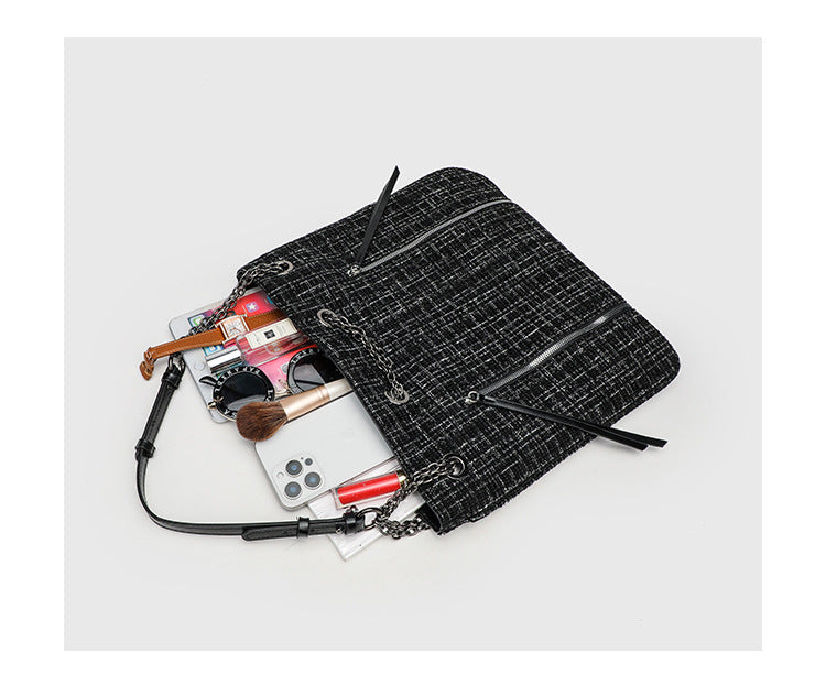 Große schwarze Schulter-Tote-Bag mit Tweedstruktur, silberfarbener Kette und Riemen in Lederoptik, Metallösen und Außenreißverschluss