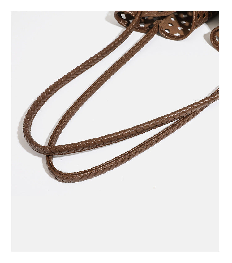 Slouchy open-lattice woven shoulder tote bag with long braided straps and matching zip pouch, detail view 18