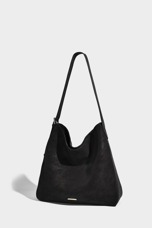 Large slouchy hobo shoulder bag in matte leather-look finish with adjustable strap and gold-tone bar hardware, detail view 19