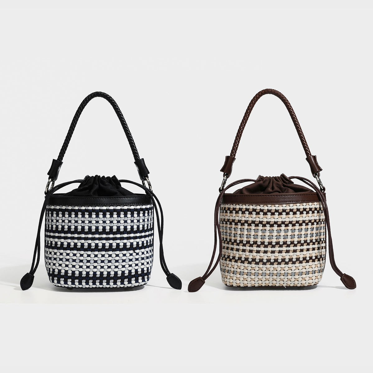 Small structured woven checker bucket bag with braided top handle, drawstring closure, and silver-tone hardware in black