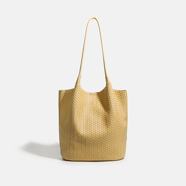 Large woven textured tote bag with long shoulder straps and structured rectangular base, detail view 6