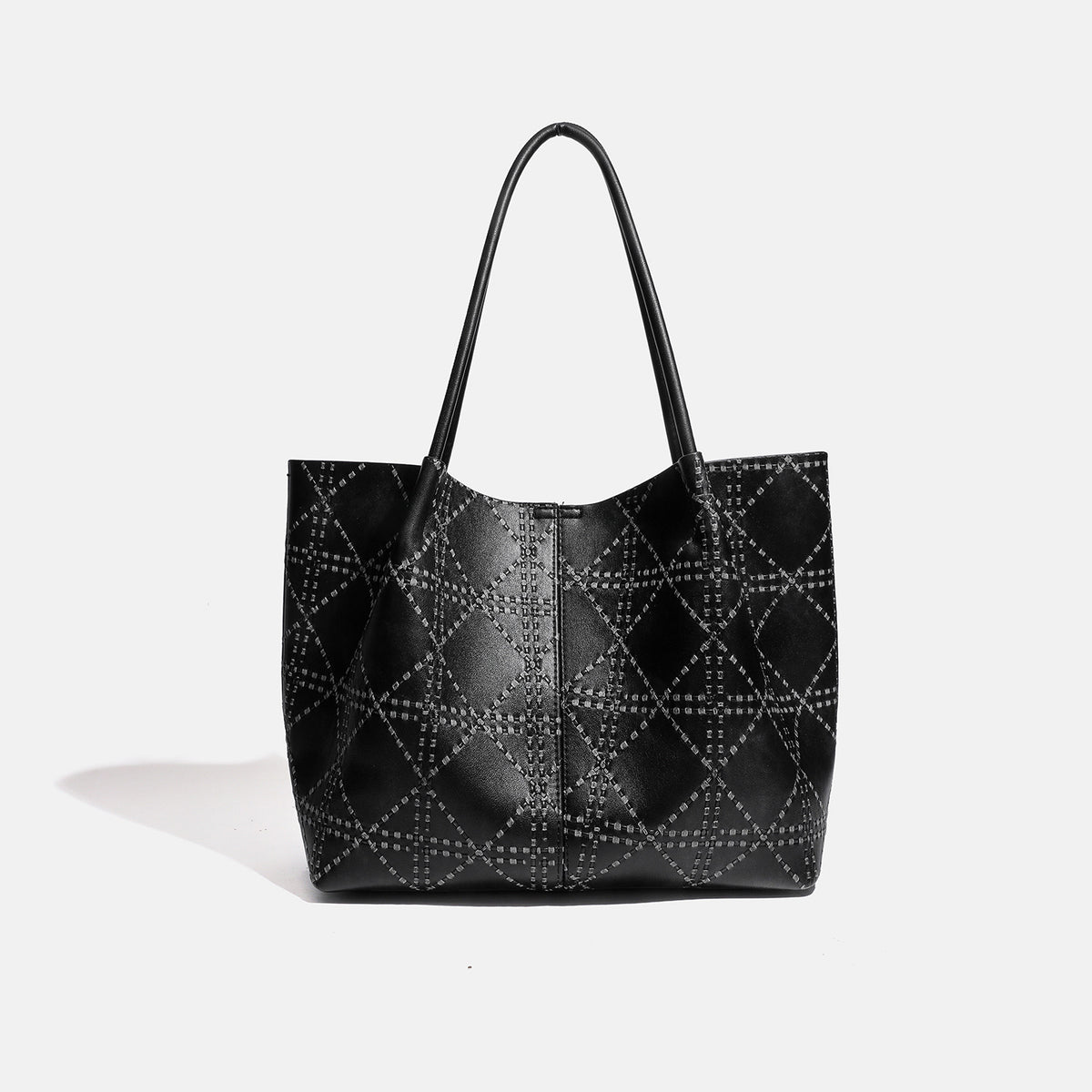 Large open-top tote bag with raised diamond-lattice stitching, long double shoulder handles, and gold-tone magnetic snap