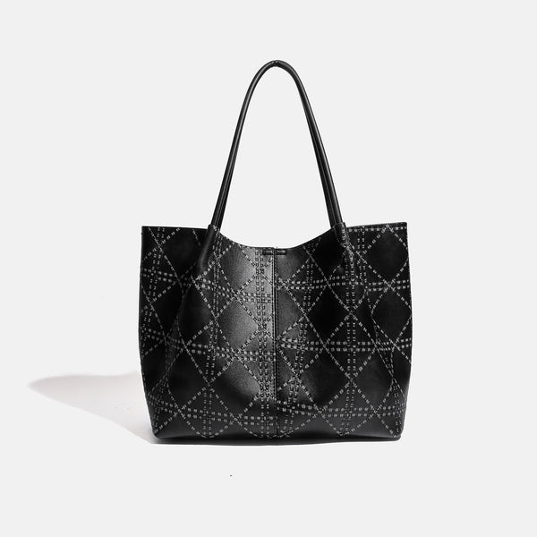Large open-top tote bag with raised diamond-lattice stitching, long double shoulder handles, and gold-tone magnetic snap